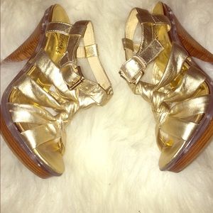 Michael Kors gold woven heel sandals.